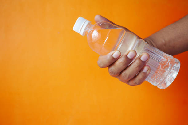 istock hand golding fresh drinking water bottle 1333673599
