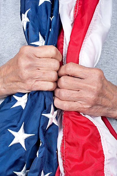 istock Elderly woman holding American flag 133367474
