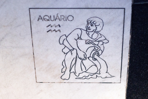 panel with an Aquarius sign on a marble stone in Rio de Janeiro.
