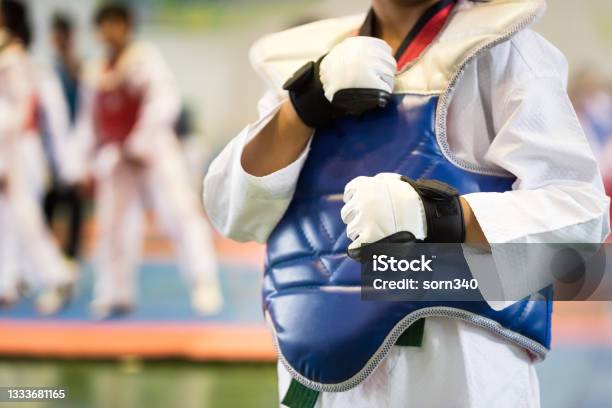 Taekwondo Kids Athletes Moment Of Athlete To Warm Up And Strike An Opponent During The Tournament Taekwondo Kids Stock Photo - Download Image Now