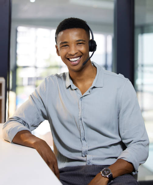 istock Portrait of a young man using a headset in a modern office 1333685156