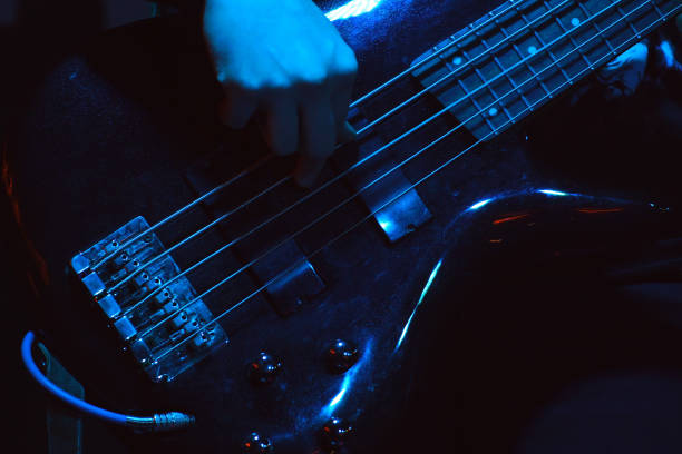 istock The bass player plays a five-string bass guitar 1333686846