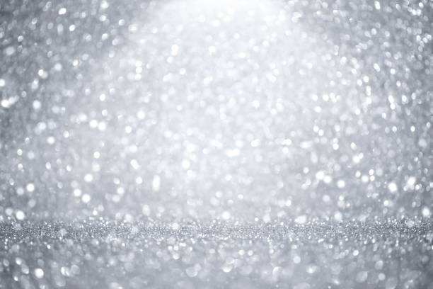 istock silver christmas background with bokeh and glitter 1333687614