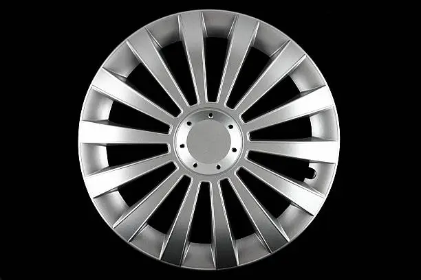 A photo of a hubcap isolated on black background.