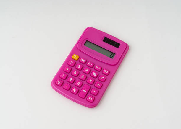 istock Cute pink color calculator isolated white background. 1333693095