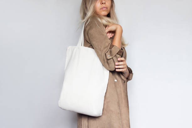 istock A woman with an eco linen bag with copy space 1333693831