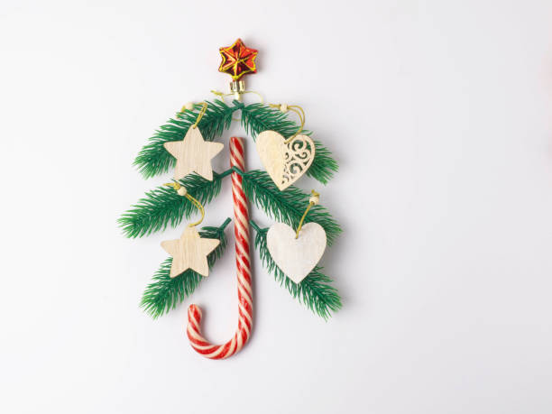 istock Christmas holiday background with board and decorations, gift boxes on the gray textured board View from above 1333694849