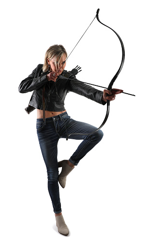 Senior woman aiming bow and arrow. Cut out on white background