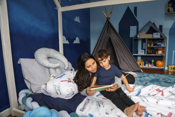 istock A mother reading to her four-year-old son. 1333703598