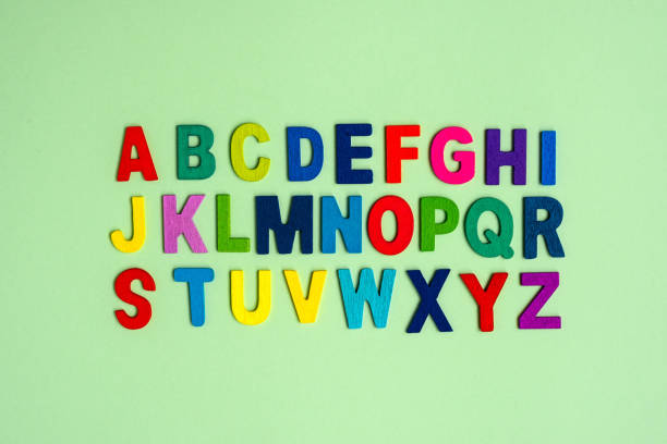 istock Colorful alphabet lettering on a green background 1333704849