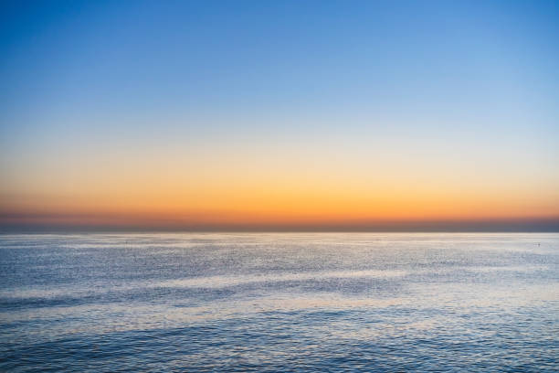 istock Sunrise over sea and blue sky 1333712473