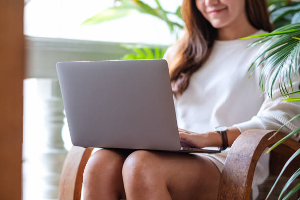 istock a beautiful young asian woman using and working on laptop computer on balcony with houseplants garden at home 1333715020