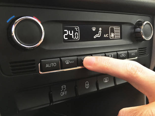 istock Adjusting the car air conditioner 1333717491