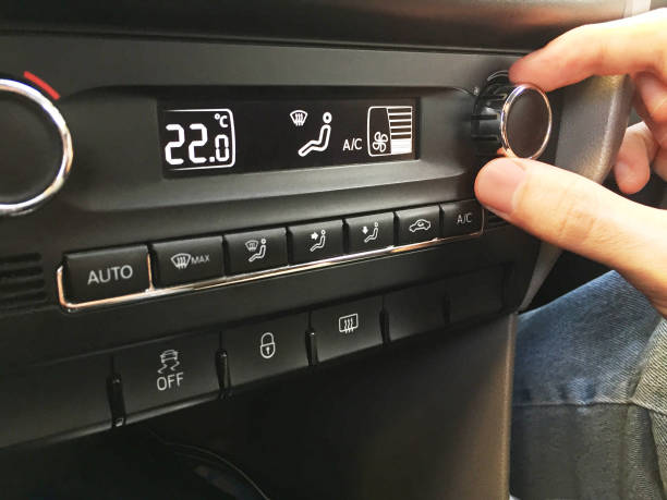 istock Adjusting the car air conditioner 1333717516