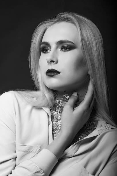 istock Elegant blond model posing with foil on her neck 1333721878