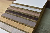 Samples of fibreboard panels with wood texture. Laminated CPD. Chipboard PVC edge. Wooden furniture CMD and MDF.