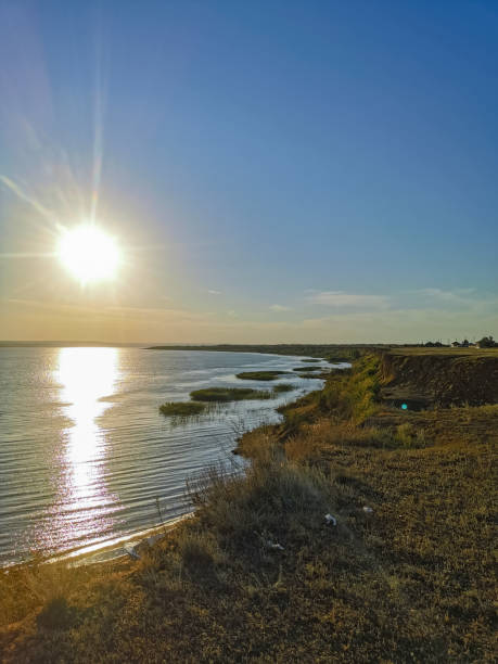 istock sun at sunset over the river. cliff shooting 1333726536