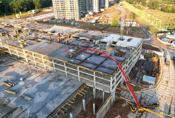istock Pouring concrete from mixer truck. Tower crane on formwork at construction site. 1333728525