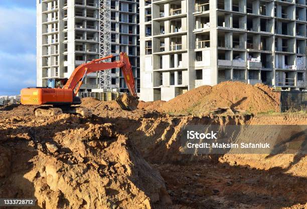 Excavator Digging Foundation At Construction Site Heavy Machinery For Groungwork House Construction Project Working Stock Photo - Download Image Now