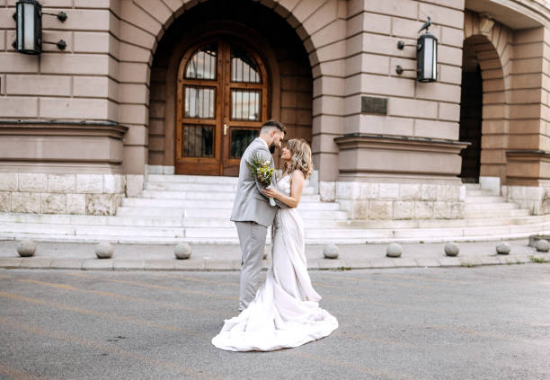 Beautiful bride and groom dancing outdoors