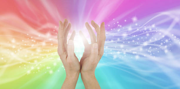 istock Healing hands and rainbow energy field 1333732018