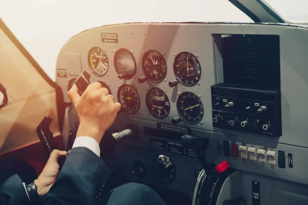 istock Pilot hand or private flight captain control airplane with many aircraft gauge in cockpit dashboard. 1333733609