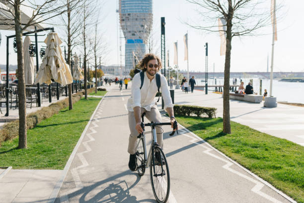 istock Good looking, fashionable young environmentalist riding his bicycle to work 1333734847