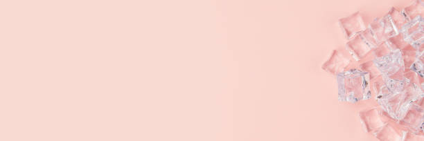 istock There are ice cubes on a pink background. 1333734900