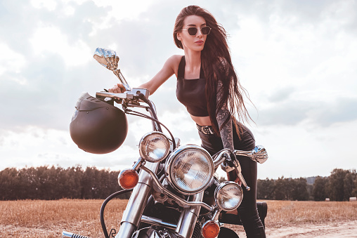 Young woman on motorcycle.