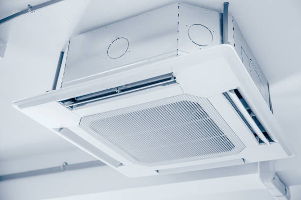 istock Commercial Ceiling Cassette Air Conditioners setup in office without ceiling sheet blue clean colortone. 1333736217