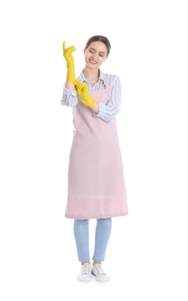 istock Young chambermaid wearing gloves on white background 1333736315