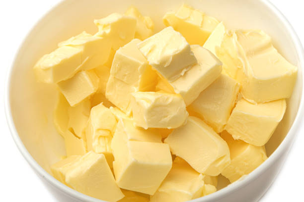 istock Fresh butter cubes close-up in a white bowl. 1333739868
