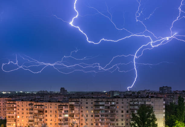istock Thunderstorm with lightning above the night city 1333739897