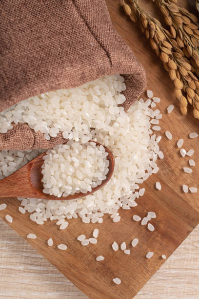 istock White rice in a bowl on wooden table background. 1333741108