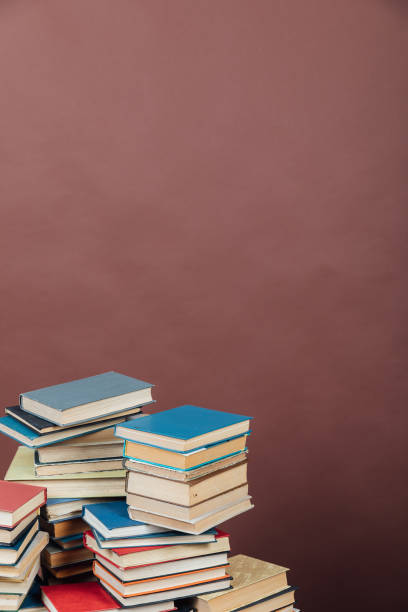 istock Stacks of books for teaching knowledge university library brown background 1333741236
