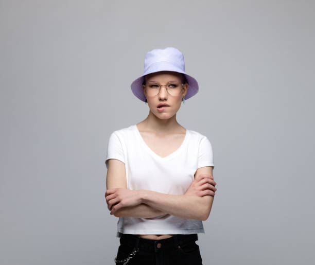 istock Thoughtful young woman with lilac bucket hat 1333741324