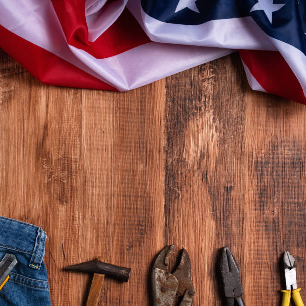 istock Top view design concept of Labor Day with working tools and jeans. 1333741467