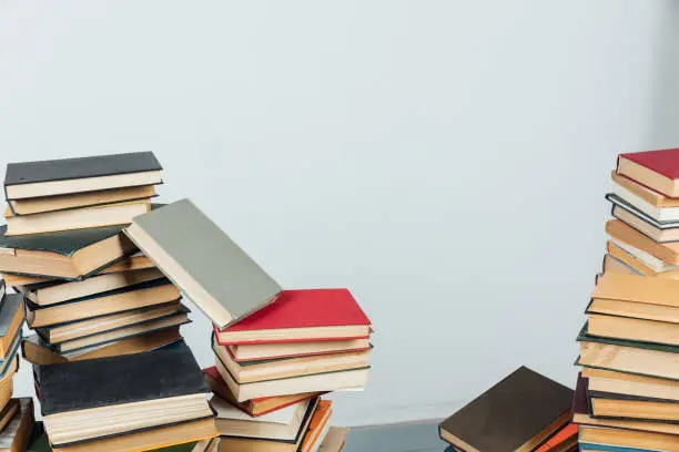 Photo of Stacks of books for teaching knowledge library university school white background