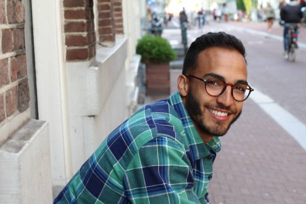 istock Young mixed race man sitting at home staircase 1333742641