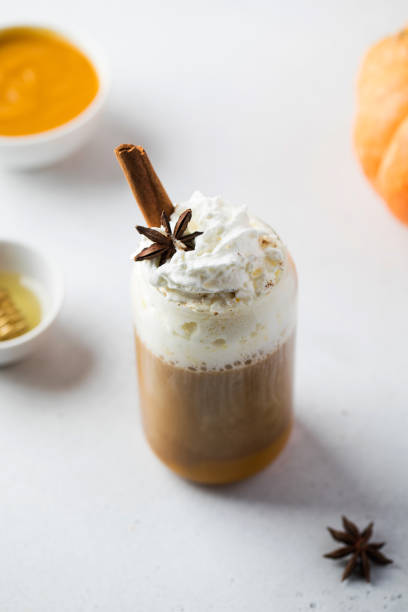istock Pumpkin coffee with whipped cream and spices on table 1333742728