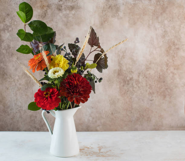 istock Elegant bouquet of fresh flowers with spikelets on table. Copy space. 1333743614