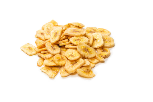 istock Banana chips isolated on a white background. Dehydrated banana. 1333746022