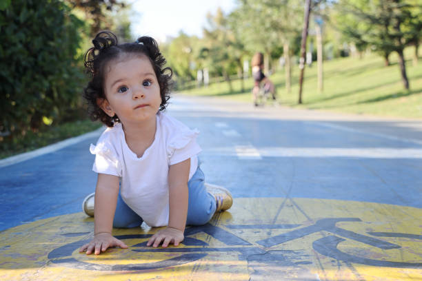 Girl playing on bicycle lane