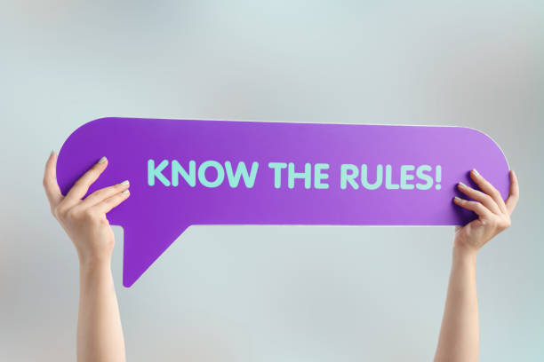 two hands carrying a speech bubble saying know the rules