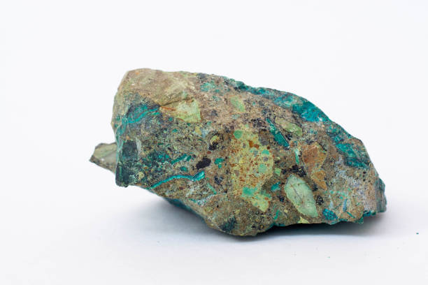 istock copper ore from a copper mine in Chile, a green stone on a white background. 1333751814