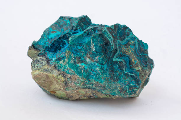 istock copper ore from a copper mine in Chile, a green stone on a white background. 1333751853