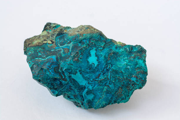 istock copper ore from a copper mine in Chile, a green stone on a white background. 1333751899