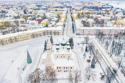 Aerial drone view of Orthodox Church of Elijah the Prophet and old city center in winter of Yaroslavl, Russia. Ancient russian city of the touristic Golden Ring