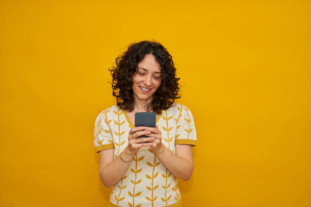istock Young woman using mobile phone 1333757303