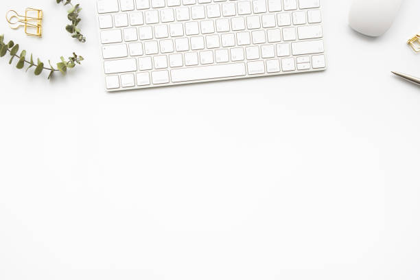 istock Beautiful white office desk table with computer keyboard and mouse with office supplies. Top view with copy space, flat lay. 1333758659